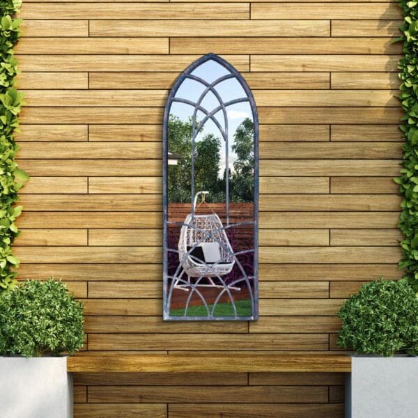 Indigo Garden Window Mirror 121x45cm. Mounted on an outdoor fence.