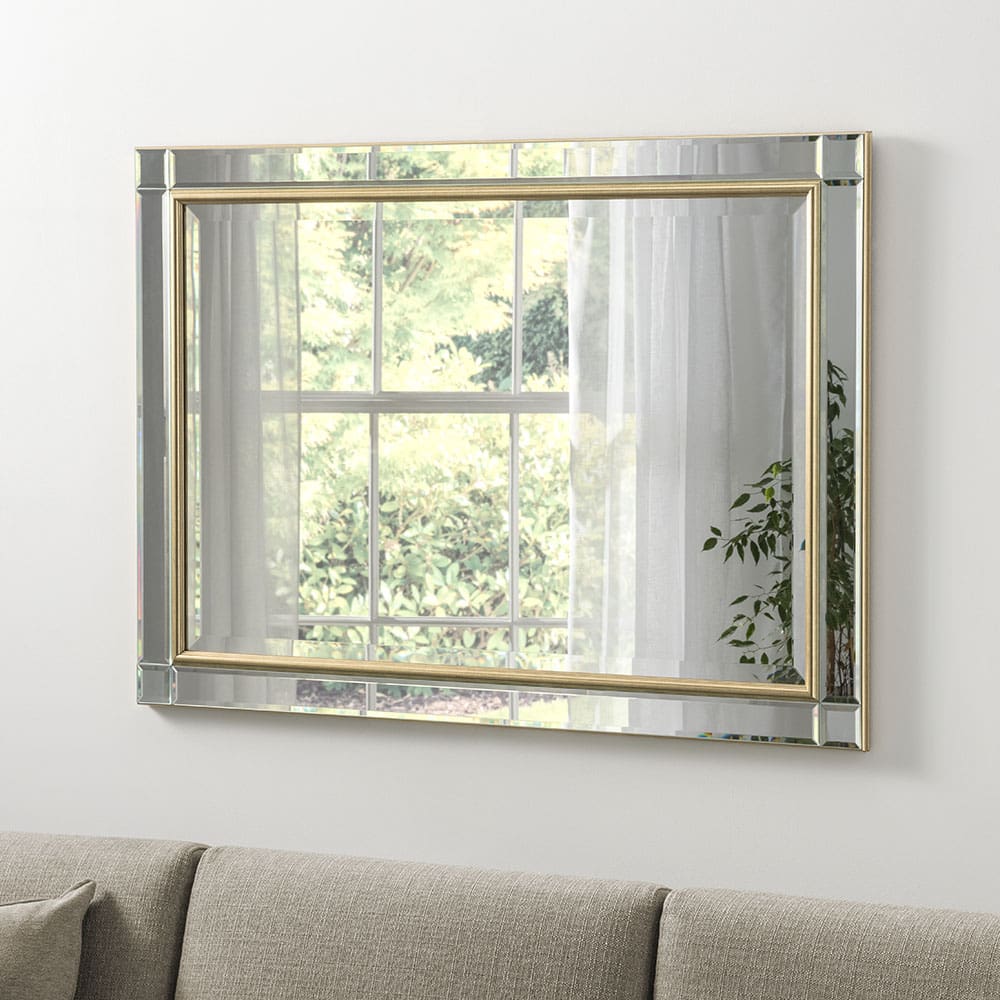 Handcrafted Milan gold mirror. Wall mounted in the living room above a sofa.