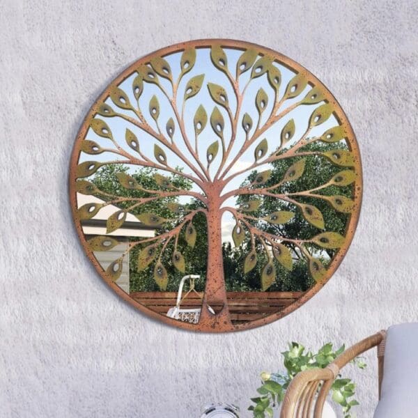 Round outdoor mirror measuring 80cm featuring a colourful tree mounted onto a masonry garden wall.