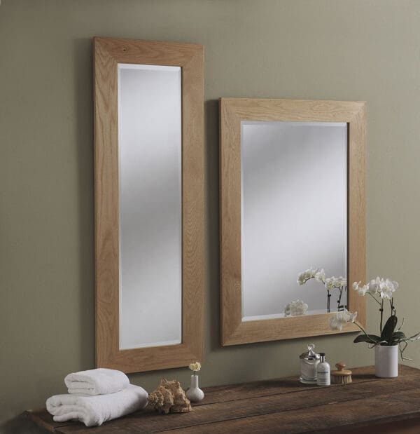 Oak framed wall mirror. Full length and rectangle design. Wall mounted above a side board.