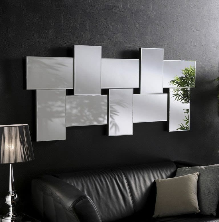 Large art deco funky mirror. Wall mounted in the living room above the sofa.