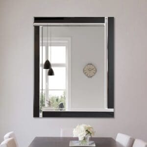 Large frameless black glass Exminster mirror wall mounted in the dining room.