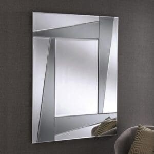 British made funky glass mirror. Two tone grey glass. Wall mounted in the living room.
