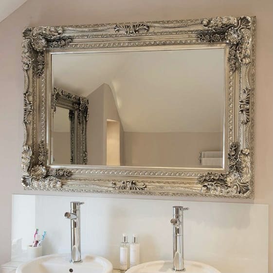 Chunky silver framed mirror. Rectangle mirror wall mounted in the bathroom. Bevelled edge glass.