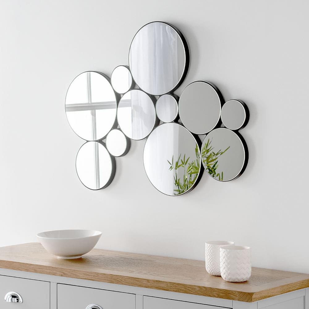 British made multiple circular mirror. Wall mounted in the dining room 