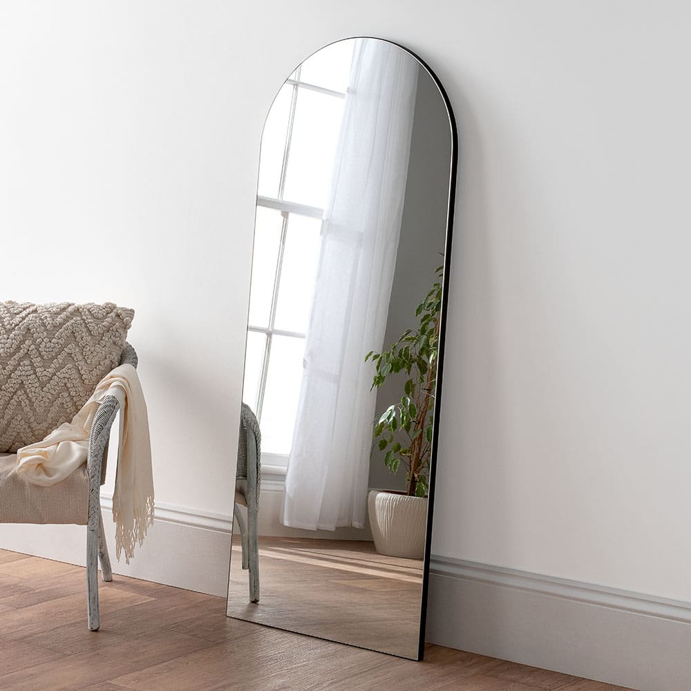 Leaner bedroom mirror. Modern frameless black edge mirror. Made in London.