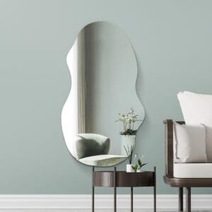 Large irregular mirror wall mounted the a modern living room.