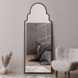 Mahal Dome Black Metal Mirror Leaning against Bedroom Wall