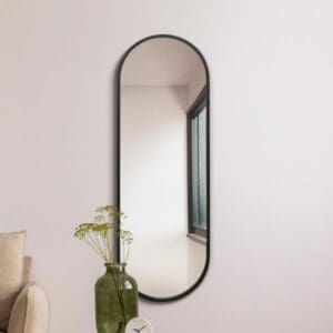 Addison Full Length Black Oval Mirror 160x55cm. Wall mounted as a living room mirror.